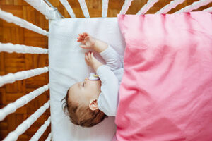 Baby girl sleeping in his bed