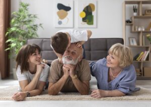 full-shot-happy-family-floor-indoors